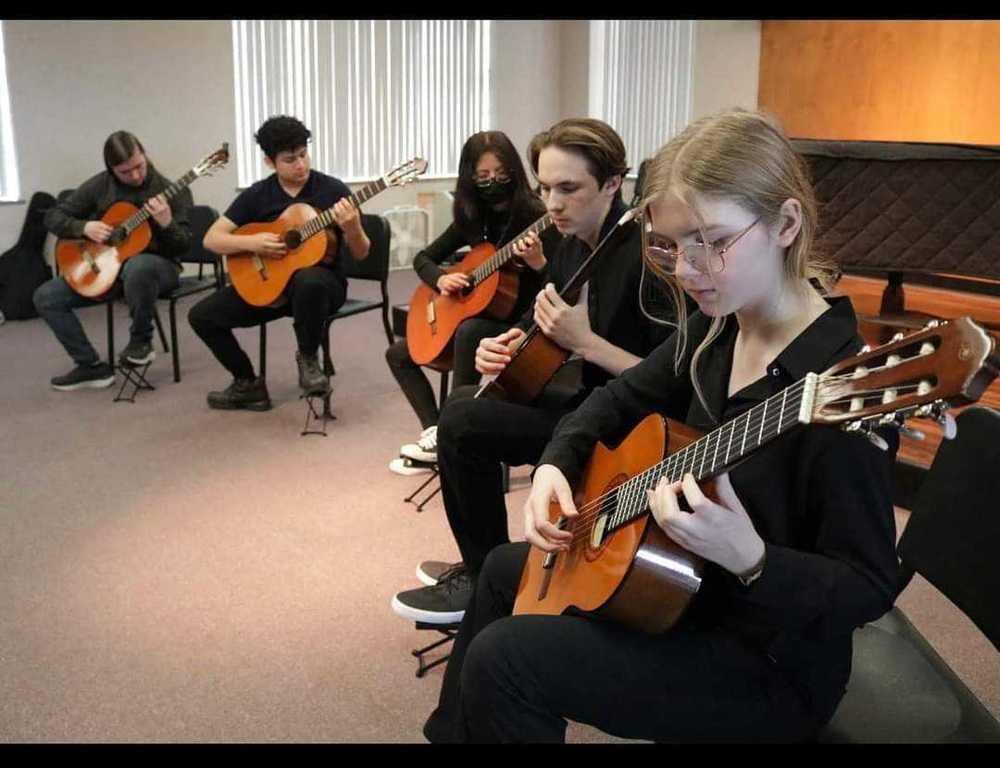 EHS Students Practicing Guitar