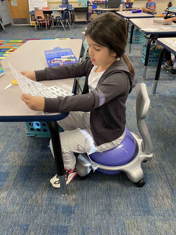 Makayla Huizar uses one of the flexible seating chairs to work and study in Haley Batchelder’s class, 1st grade at Hayes Elementary.