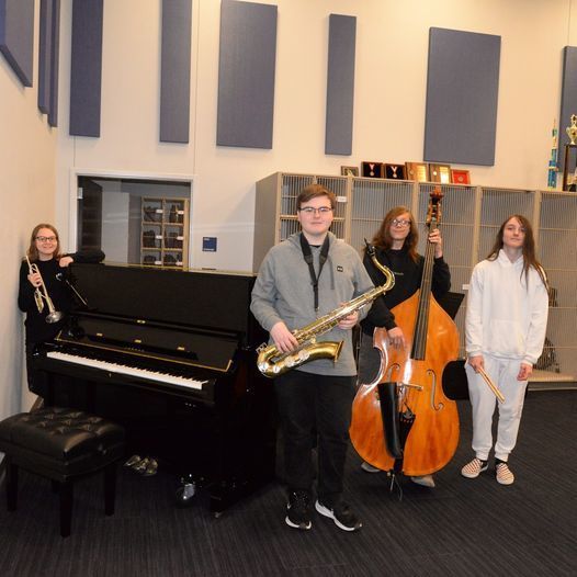 Students display new cello, saxophone, and piano